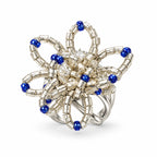 Aster — blue sculptural beaded ring by ArtsWeave, isolated on a white background