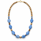 Caelum — blue geometric beaded necklace by ArtsWeave, isolated on a white background