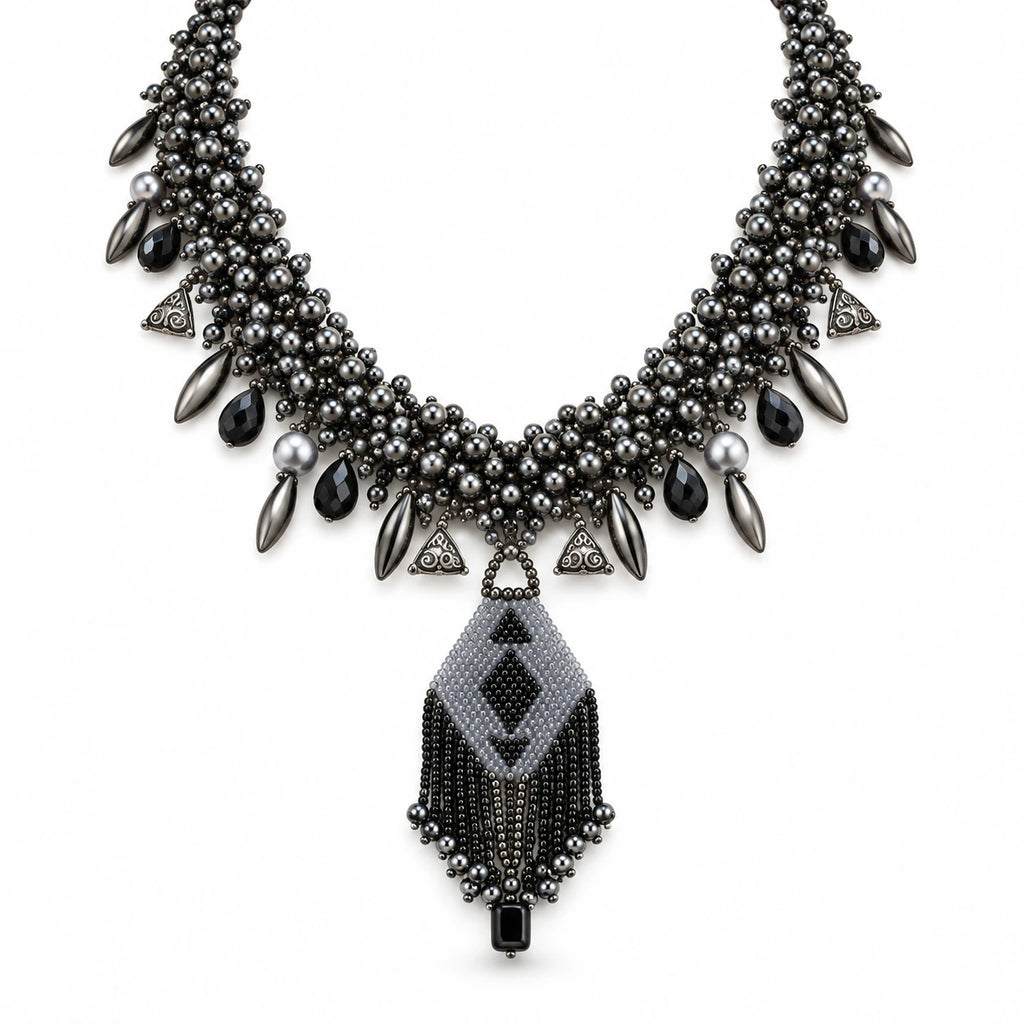 Sable — black geometric fringe necklace by ArtsWeave, isolated on a white background