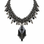 Sable — black geometric fringe necklace by ArtsWeave, isolated on a white background
