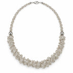 Veil — silver-tone ruffled beaded necklace by ArtsWeave, isolated on a white background